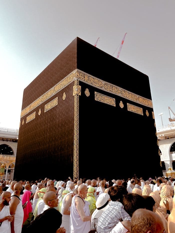 A large crowd of pilgrims surrounding the Kaaba in Mecca, Saudi Arabia during the Hajj pilgrimage.